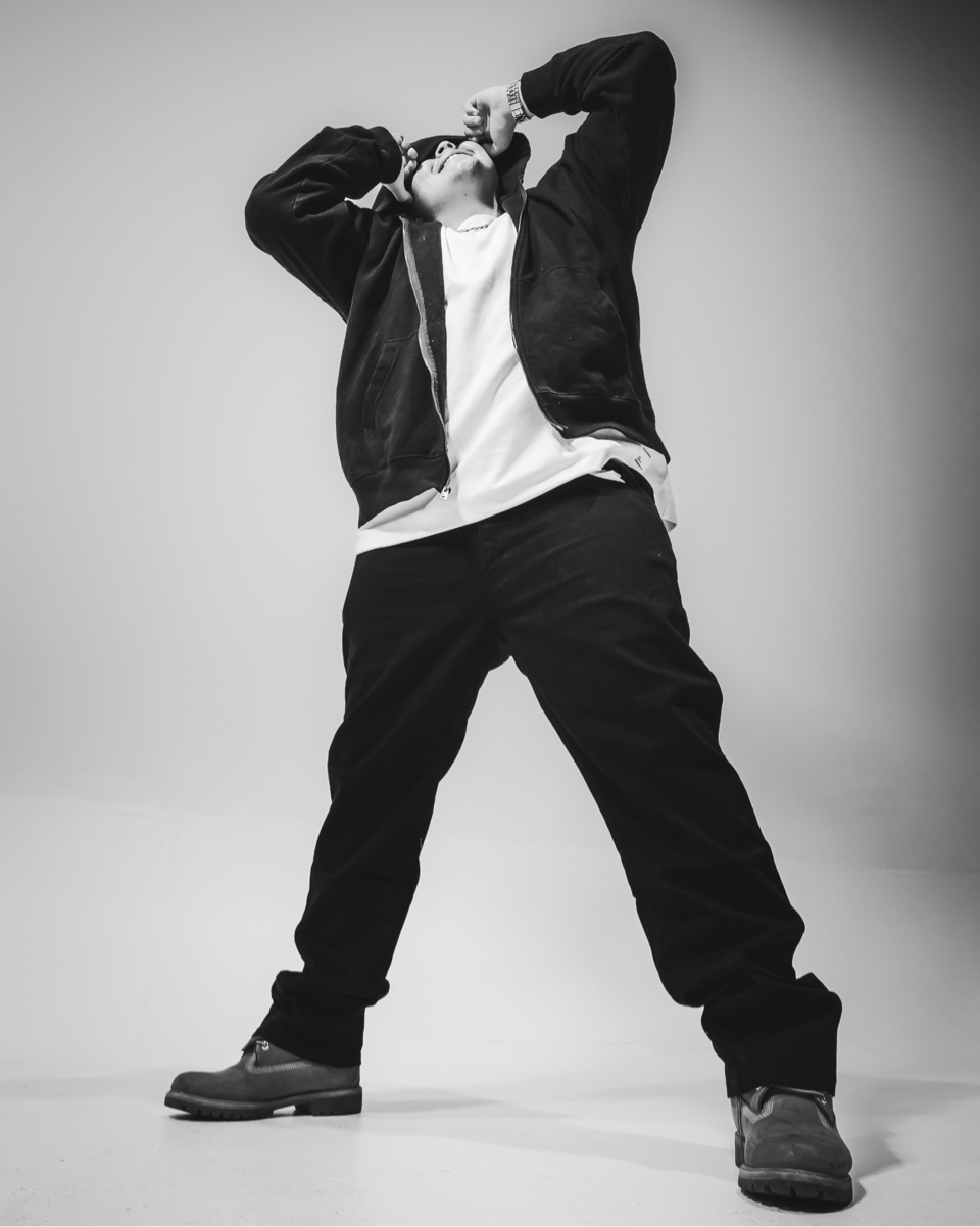 Lil Ryry in a black and white full-length studio portrait